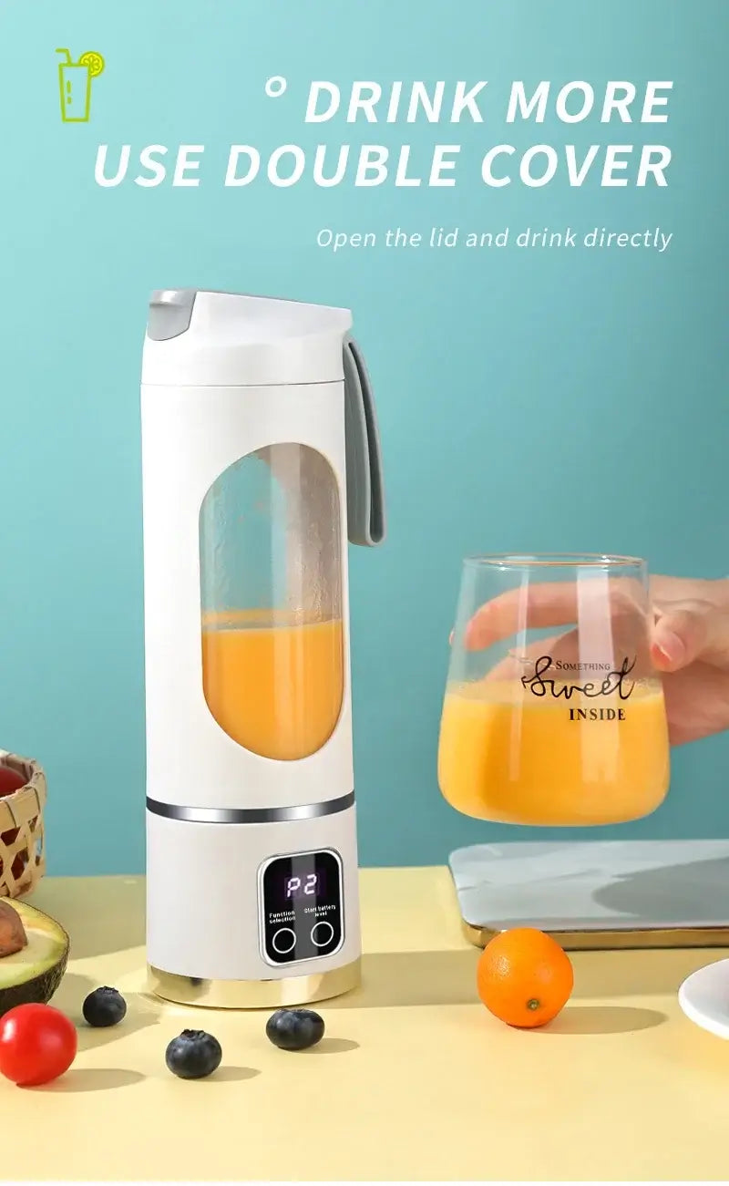 Electric mini portable blender with orange juice, featuring double cover design, placed on kitchen counter with fruits.