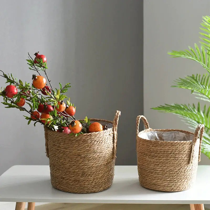 Nordic handmade straw woven flower pot and planter basket on a table with green plant nearby, creative natural countryside style.
