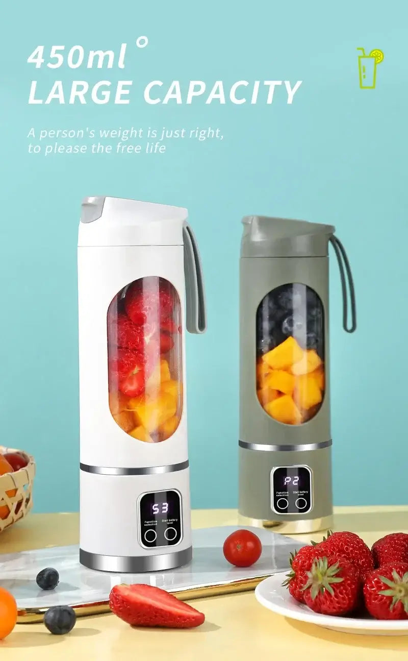 Portable electric juicer blender in white and gray with 450ml capacity, filled with fresh fruit, ideal for smoothies and juices.
