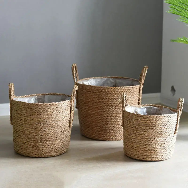 Nordic handmade woven straw flower pots with handles, ideal for potted plants or storage, displayed indoors in various sizes.